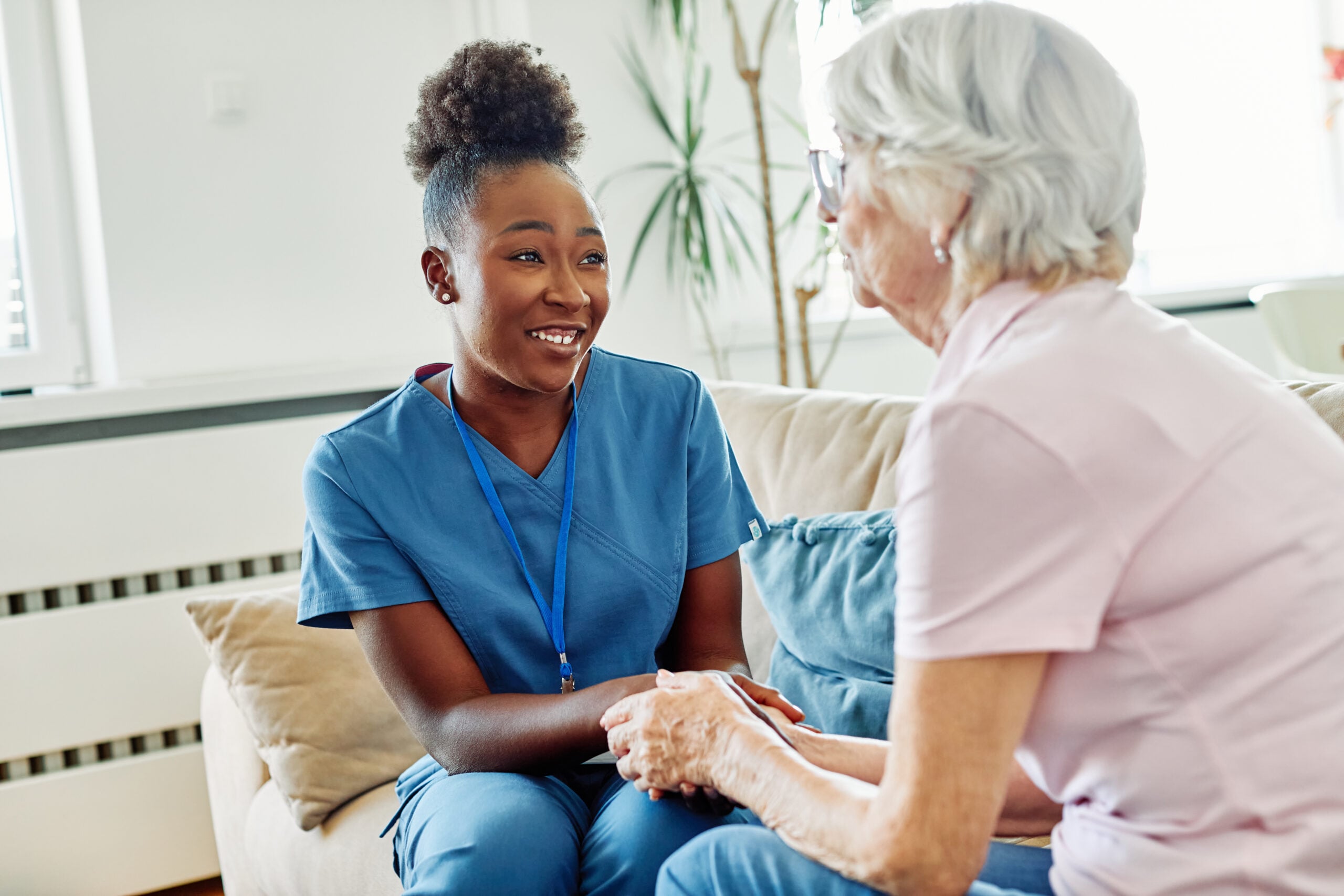 Caregiver providing compassionate in-home care assistance to a senior in Farmington Hills, MI.